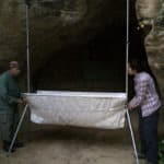 Merlin Tuttle and Antonia Hubancheva set the Tuttle trap in front of the cave